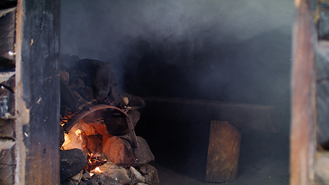 A sauna full of smoke from an open fire